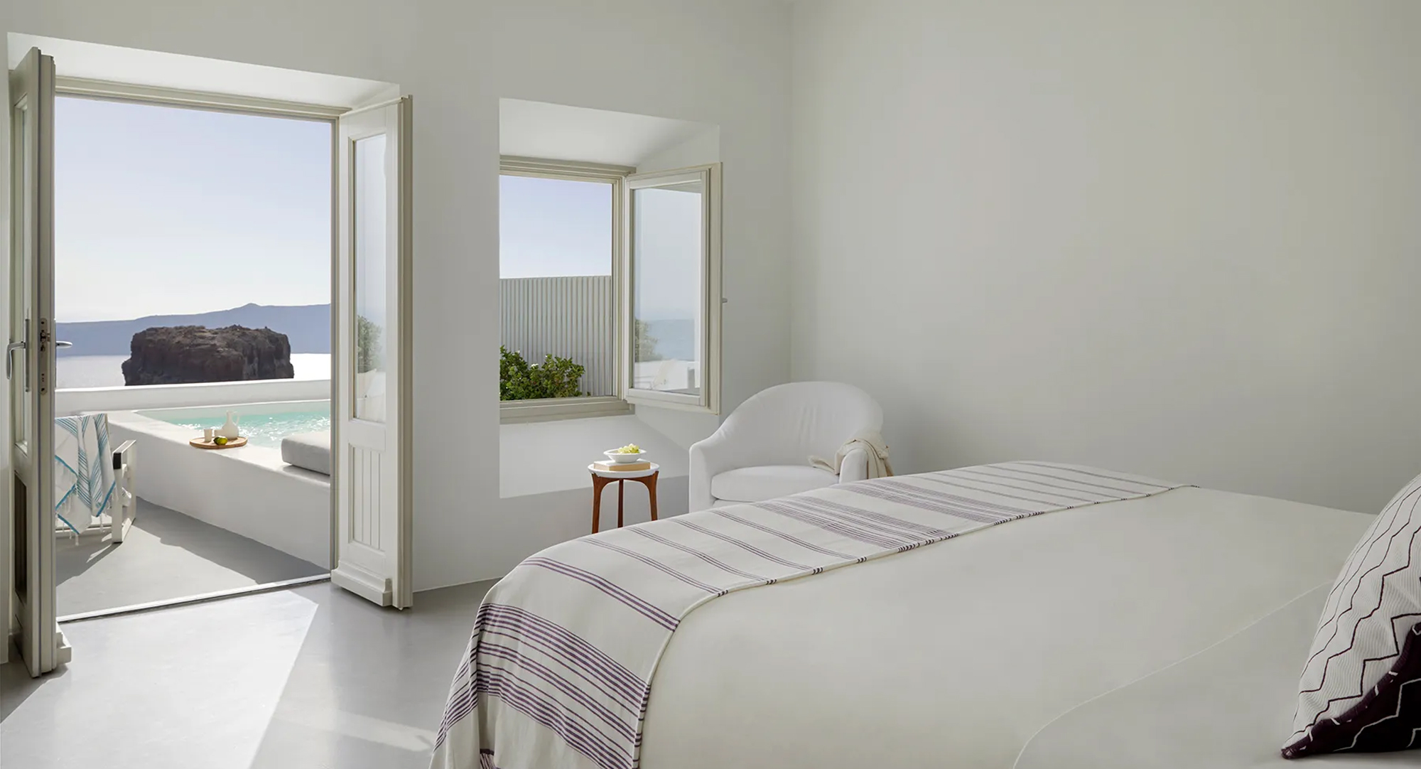 Elegant minimalist room interior at Grace Hotel Santorini – luxury stays at exclusive CountryClubuk Member pricing