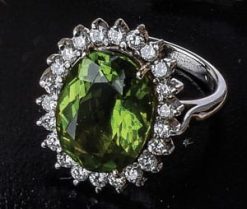 Exceptional vivid peridot, diamond and 18ct gold ring