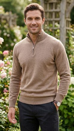 Man wearing Massoti Italian extrafine lambswool half-zip sweater in fawn, styled in a classic garden setting – premium Italian knitwear for gentlemen