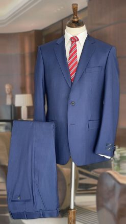 Smart navy suit, well cut and tailored by the experts, Magee 1866—and this time with a contemporary subtle stripe and stretch for all-day style and comfort