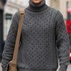 Men’s charcoal Aran roll neck jumper in merino wool with cable knit patterns at CountryClubuk