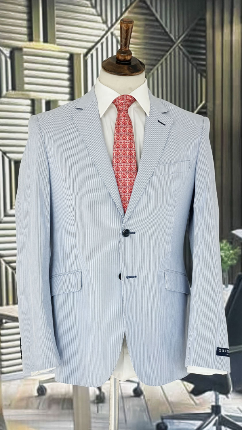 Striped summer jacket in sky blue and white by English tailors Gurteen: well cut, high quality, cool as a cucumber and perfect for stylish sporting and social events