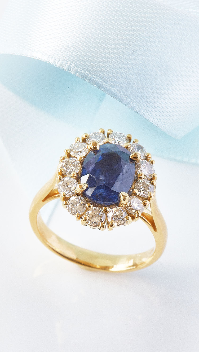 Stunning large 3.86 carat natural Blue Sapphire showcased at the heart of this new Diamond Cluster Ring from London's Hatton Garden: Beautifully set on 18ct Yellow Gold, it's a ring of exquisite beauty with contemporary yet classic style