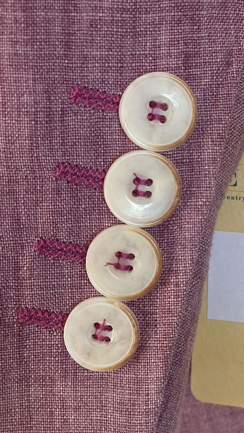 Close-up of cuff buttons and magenta contrast stitching on Gurteen Naples Jacket 61001-161