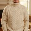Aran knit men's roll neck jumper in Merino wool by West End Knitwearbest price at CountryClubuk
