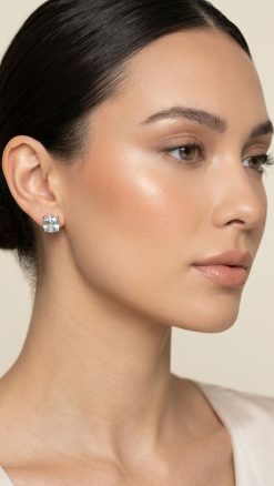 18ct gold aquamarine stud earrings 7mm cushion cut worn by model – natural gemstone solitaire studs