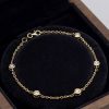 14ct gold diamond station bracelet with bezel-set diamonds presented in luxury gift box
