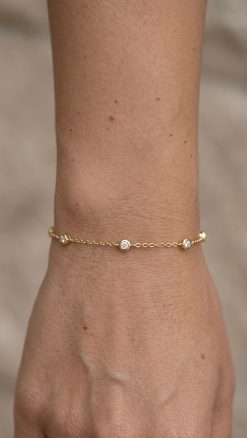 Effy New York 14ct gold diamond station bracelet with bezel-set natural diamonds worn on wrist