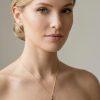 Woman wearing faceted black onyx pendant necklace 14K gold