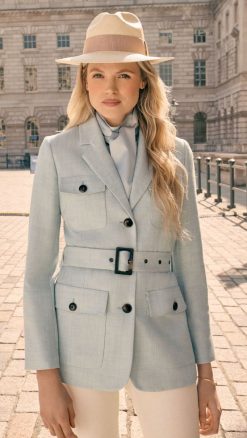 Women’s sky blue safari jacket by Really Wild with belted tailored silhouette.