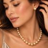 Celeste graduated golden South Sea pearl necklace with matching pearl stud earrings worn by a model